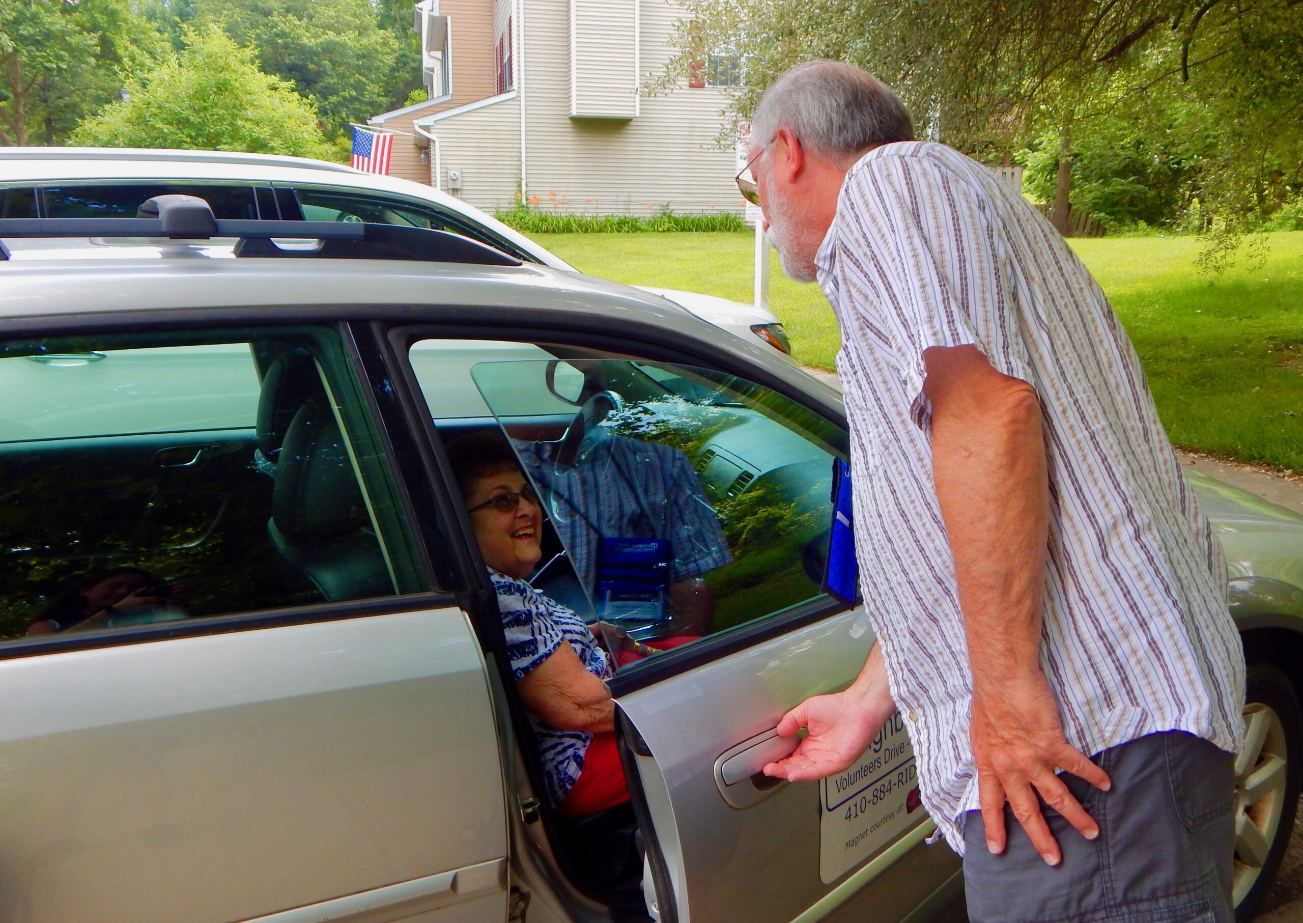 Driver opening door for rider